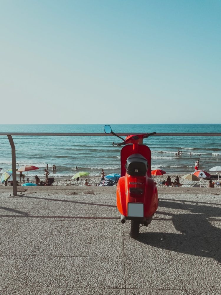 motor scooter parked near the beach